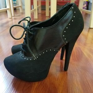 Tall black heeled booties